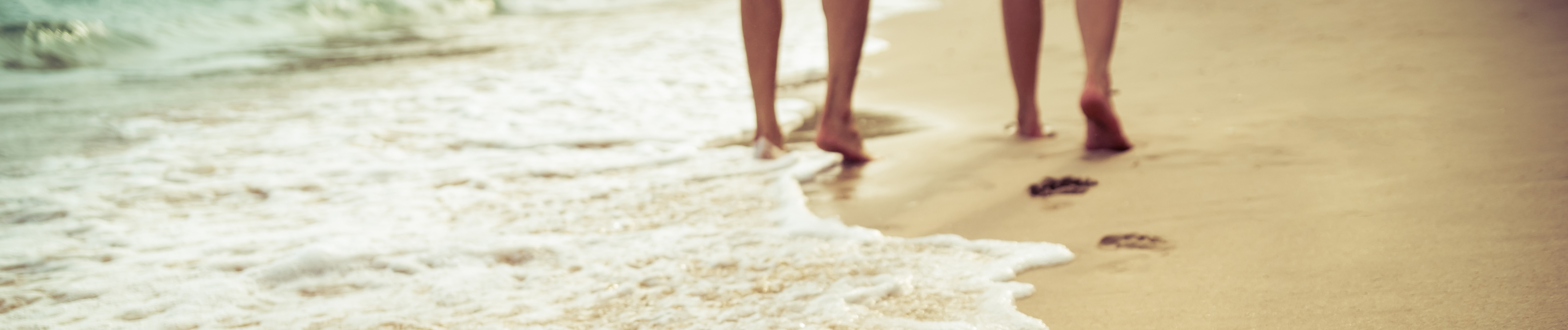 Couple walking together on Jacksonville beach symbolizing relationship journey